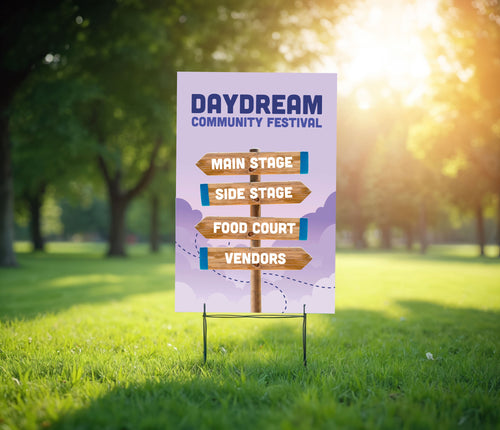 Coroplast yard sign for Daydream Community Festival with directional arrows on a grassy background