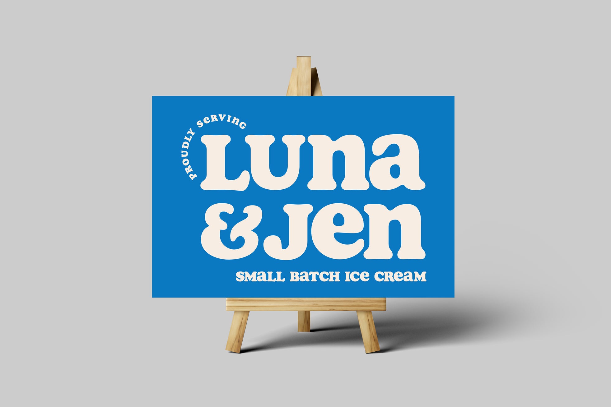 18" x 12" blue foam core sign from Cleveland Yard Signs with 'Luna & Jen' text on a gray background