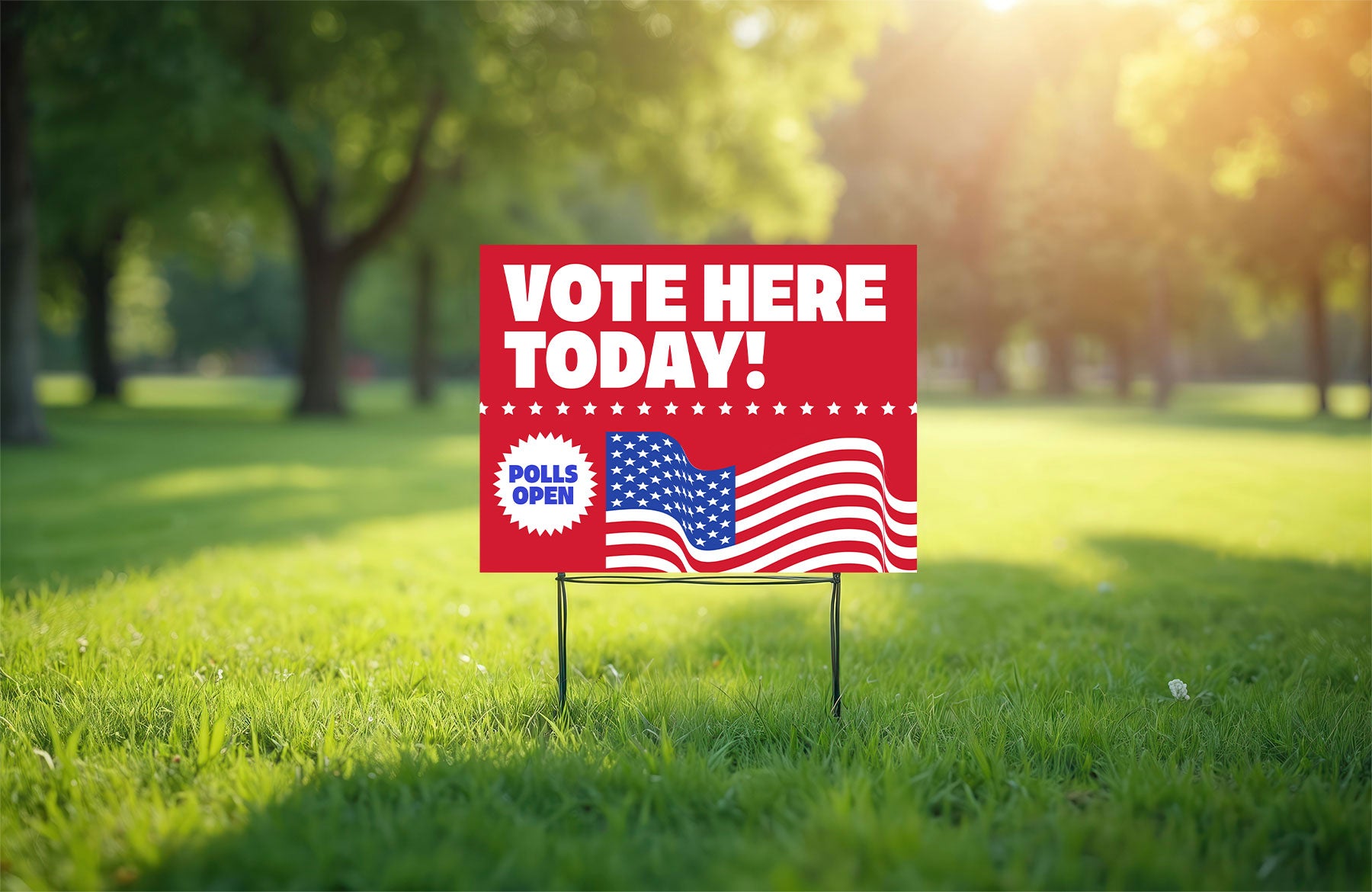 Vote here coroplast political sign by Cleveland Yard Signs in a sunny park.